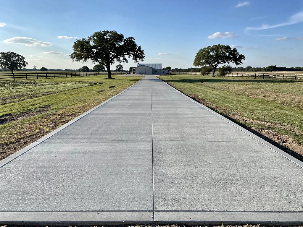 New concrete driveway installation at residential home in Conroe TX