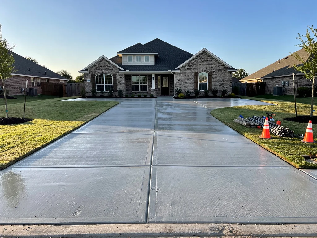 New concrete driveway installation at residential home in Magnolia TX